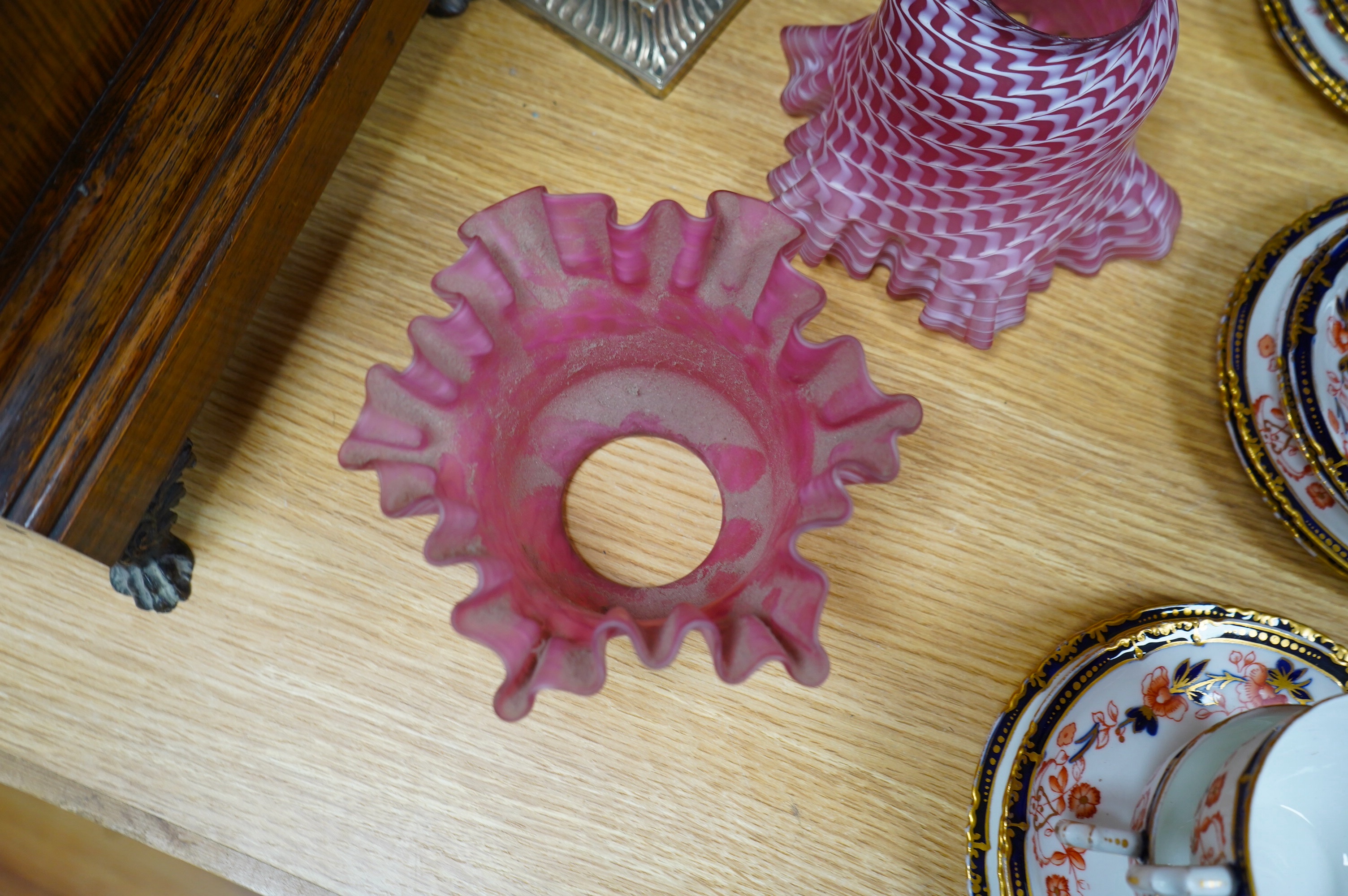 A pair of electroplate and ruby glass oil lamps, 35cm. Condition - good, not tested as working